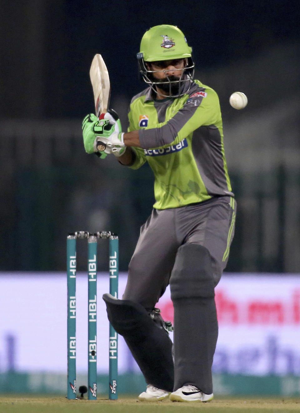 Lahore Qalandars batsman Mohammad Hafeez plays a shot during the Pakistan Super League T20 cricket match against Islamabad United, at Gaddafi Stadium in Lahore, Pakistan, Sunday, Feb. 23, 2020. (AP Photo/K.M. Chaudary)