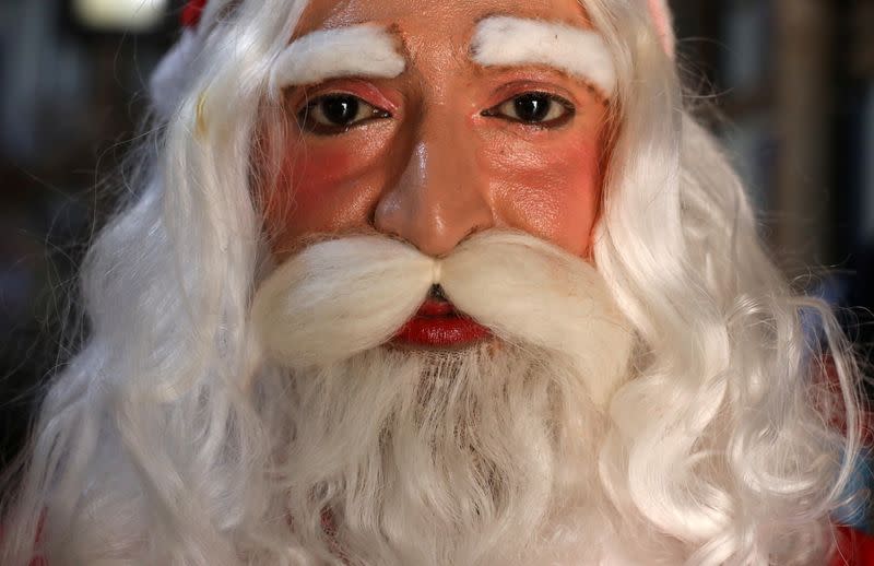 The Wider Image: Christmas wishes from Santas around the world