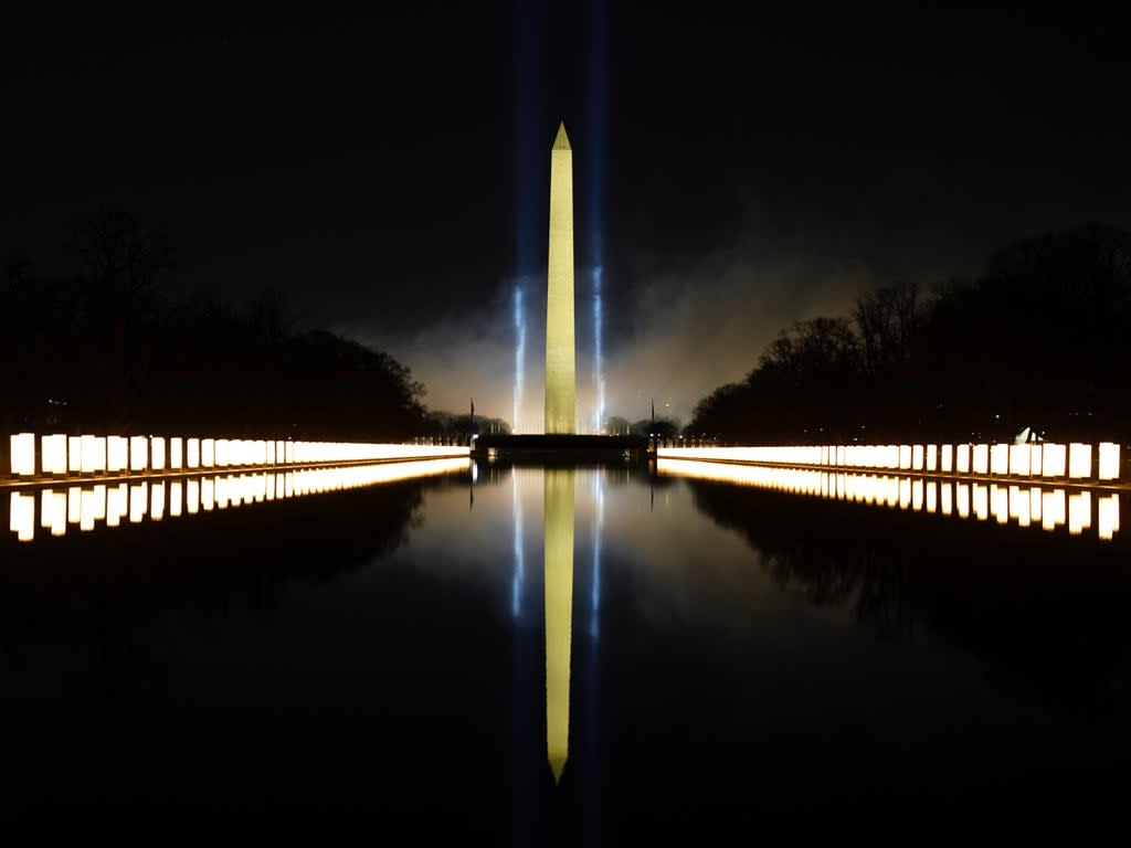 The Washington Monument lit up on 20 January in memory of 400,000 Americans who had died of Covid (Getty Images)