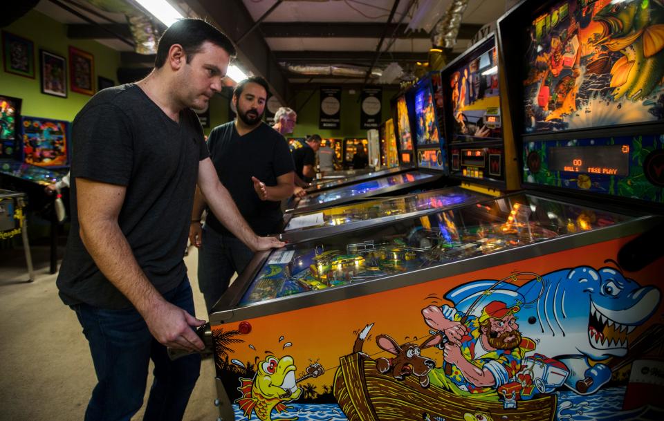 TV weatherman Eric Stone, formerly of WINK News, participates in a weekly league tournament at The Pinball Asylum in Fort Myers in 2019. He'll return to Fort Myers next week to compete in the 2022 IFPA World Pinball Championship.