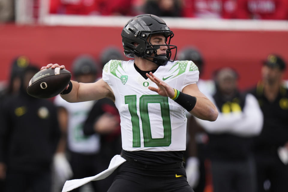 Oregon quarterback Bo Nix (10) throws during the first half of an NCAA college football game against Utah Saturday, Oct. 28, 2023, in Salt Lake City. (AP Photo/Rick Bowmer)