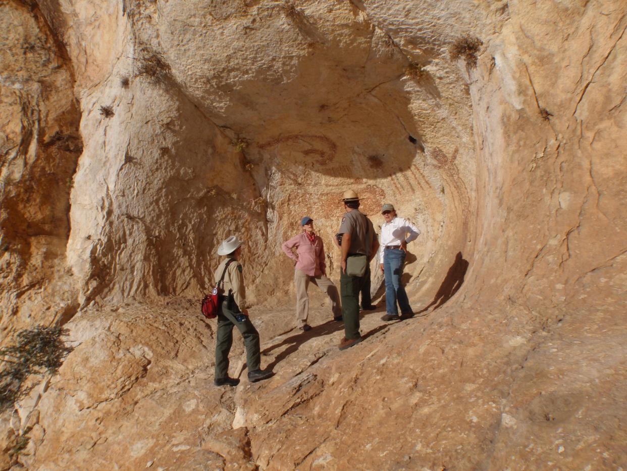 Texas Parks and Wildlife archaeologist Margaret Howard and rock art expert Carolyn Boyd from Texas State University talk with National Park Service employees about cultural resources at Devils River State Natural Area, which they jointly manage.