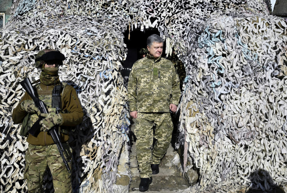 Ukrainian President Petro Poroshenko, visits a front line position at the Svetlodarsk, Donetsk region, Ukraine, Thursday, March. 14, 2019. Presidential vote in Ukraine is to take place on March 31. (AP Photo/Mykola Lazarenko, Pool)