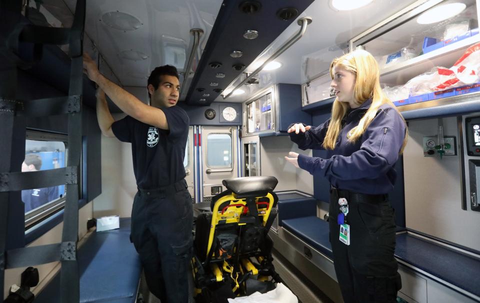 College students who volunteer for their ambulance corps at various SUNY campuses headed to Rockland during the spring 2020 COVID wave to help amid a surge of calls. SUNY Binghamton Harpur's Ferry Student Volunteer Ambulance Service EMTs Niraj Sha and Eliana Shaskar check out the supplies in an ambulance at Stony Point Ambulance Corps April 15, 2020.