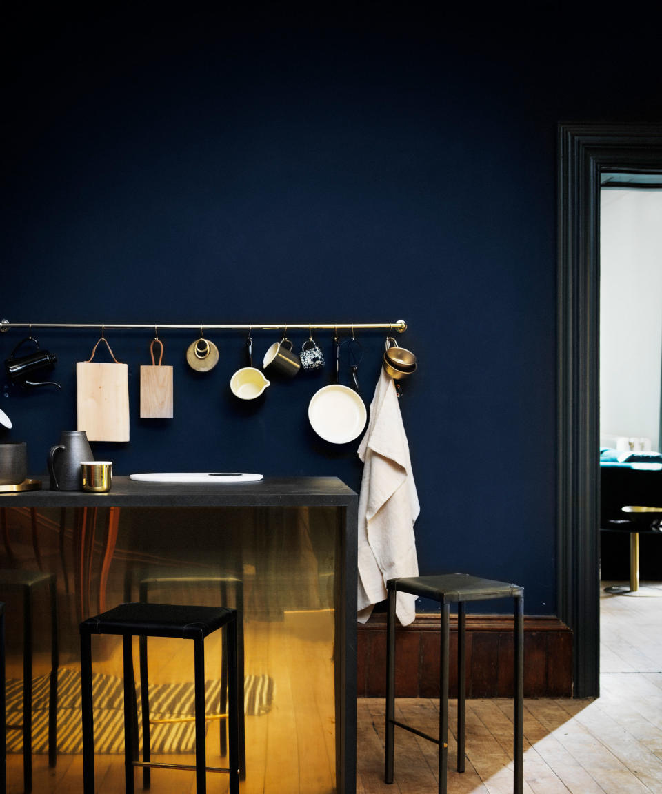 dark blue kitchen with rail