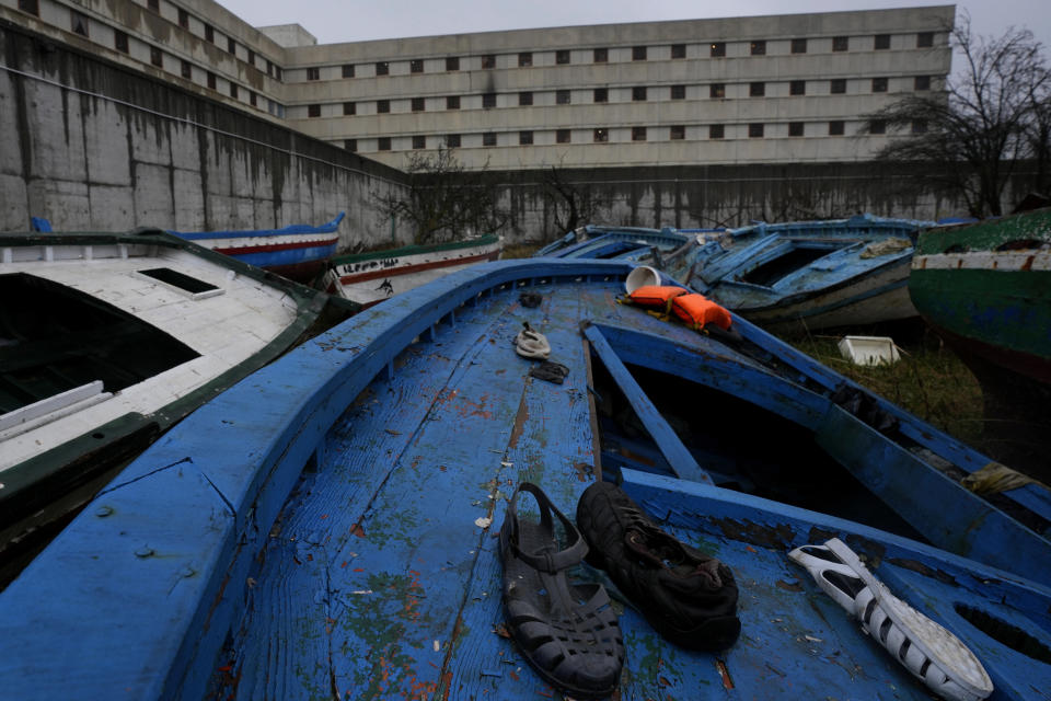 Personal belongings left in a wrecked migrants' boats lie inside the facilities of Milan's Opera maximum security prison near Milan, northern Italy, Friday, Feb. 9, 2024. Inmates at Opera took the wood of wrecked boats sailed by migrants across the Sicily Channel to craft the musical instruments that the 'Sea Orchestra' used during their debut at La Scala Opera House in Milan on Monday, Feb. 12, 2024. The violins, violas and cellos played by the Orchestra of the Sea in its debut performance Monday at Milan's famed Teatro all Scala carry with them tales of hardship. (AP Photo/Antonio Calanni)