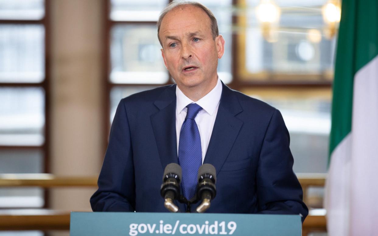 Taoiseach Micheal Martin breaks the news that the opening of 3,500 pubs will have to be postponed after a surge in coronavirus infections  - Julien Behal/PA