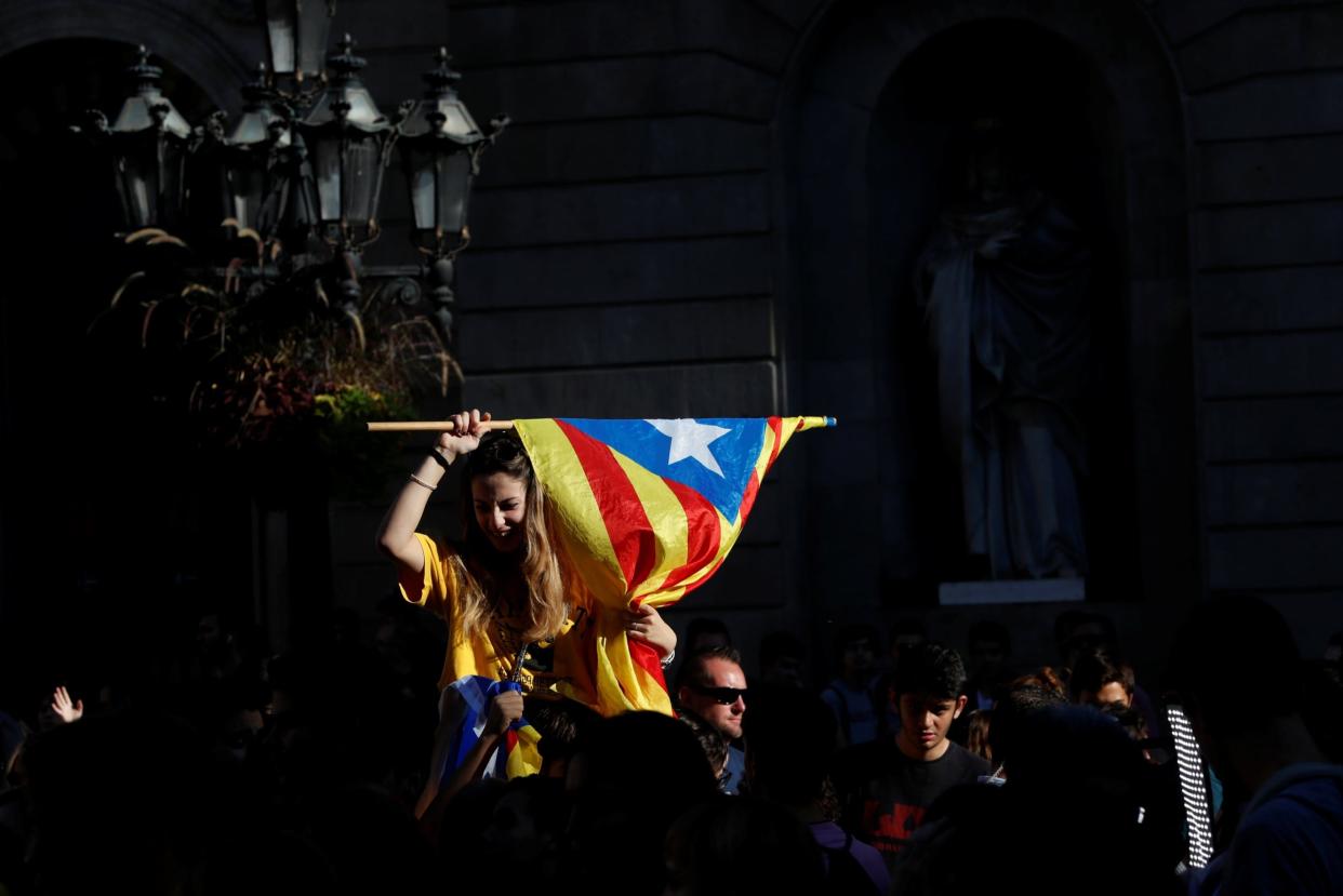 Crowds have gathered in Barcelona to celebrate the declaration of independence - REUTERS