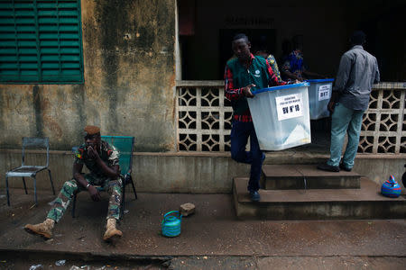 Electoral workers transport ballot boxes before the polls open during a presidential run-off election in Bamako, Mali August 12, 2018. REUTERS/Luc Gnago