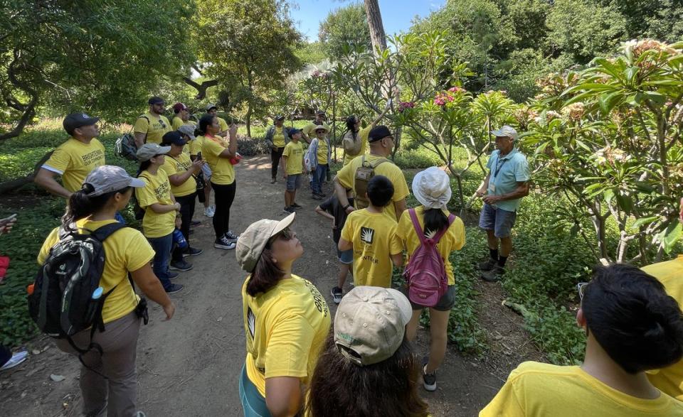 Arboretum staff give Edison volunteers historical context for the gardens and lay out plans for the day. PHOTO CREDIT: ERIKA POTTER