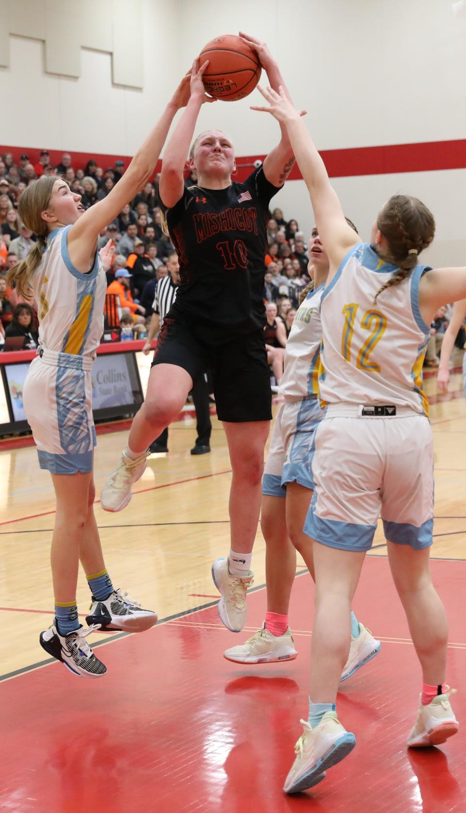 Mishicot's Kailey Tulachka drives to the basket against St. Mary Catholic on Saturday in Brillion.