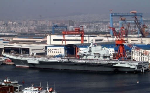 China's first aircraft carrier, the Liaoning, is berthed at the northeastern port of Dalian in September 2012. China has conducted the first landing of a fighter jet on its new aircraft carrier in a move that extends Beijing's ability to project its growing military might in territorial disputes