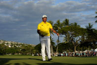 Hideki Matsuyama, of Japan, celebrates on the 18th green after winning the Sony Open golf tournament, Sunday, Jan. 16, 2022, at Waialae Country Club in Honolulu. (AP Photo/Matt York)