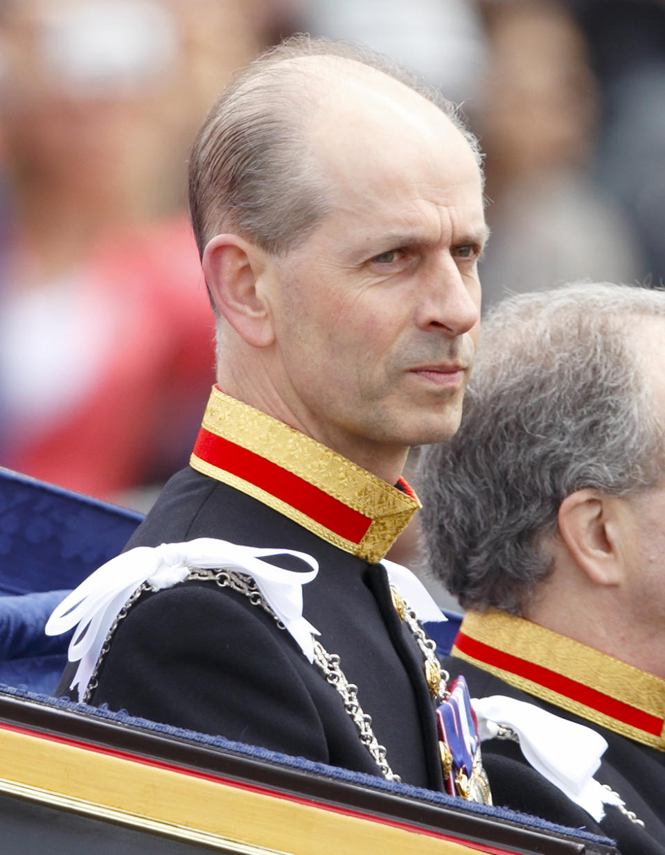 LONDON, UNITED KINGDOM - MAY 08: (EMBARGOED FOR PUBLICATION IN UK NEWSPAPERS UNTIL 48 HOURS AFTER CREATE DATE AND TIME) Paul Whybrew (L), Queen Elizabeth II's personal Page, in his role as Serjeant at Arms travels in a horse drawn carriage from Buckingham Palace to attend the State Opening of Parliament on May 8, 2013 in London, England. Queen Elizabeth II unveiled the coalition government's legislative programme in a speech delivered to Members of Parliament and Peers in The House of Lords. Proposed legislation is expected to be introduced on toughening immigration regulations, capping social care costs in England and setting a single state pension rate of 144 GBP per week. (Photo by Max Mumby/Indigo/Getty Images)