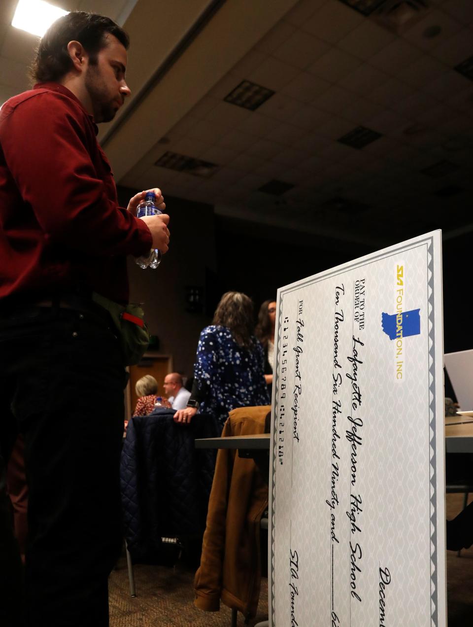 A check for Lafayette Jeff High School from the event sits against a table during a ceremony announcing recipients of the SIA Foundations grants, Tuesday, Dec. 13, 2022, at Subaru of Indiana Automotive in Lafayette, Ind.