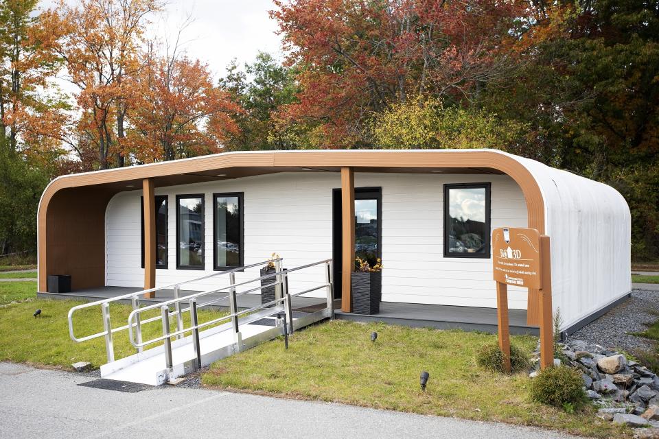 The University of Maine's first 3D printed home sits on Oct. 12, 2023, in Orono, Maine. The printer that created the house can cut construction time and labor. An even larger printer unveiled on Tuesday, April 23, 2024, may one day create entire neighborhoods. (AP Photo/Kevin Bennett)