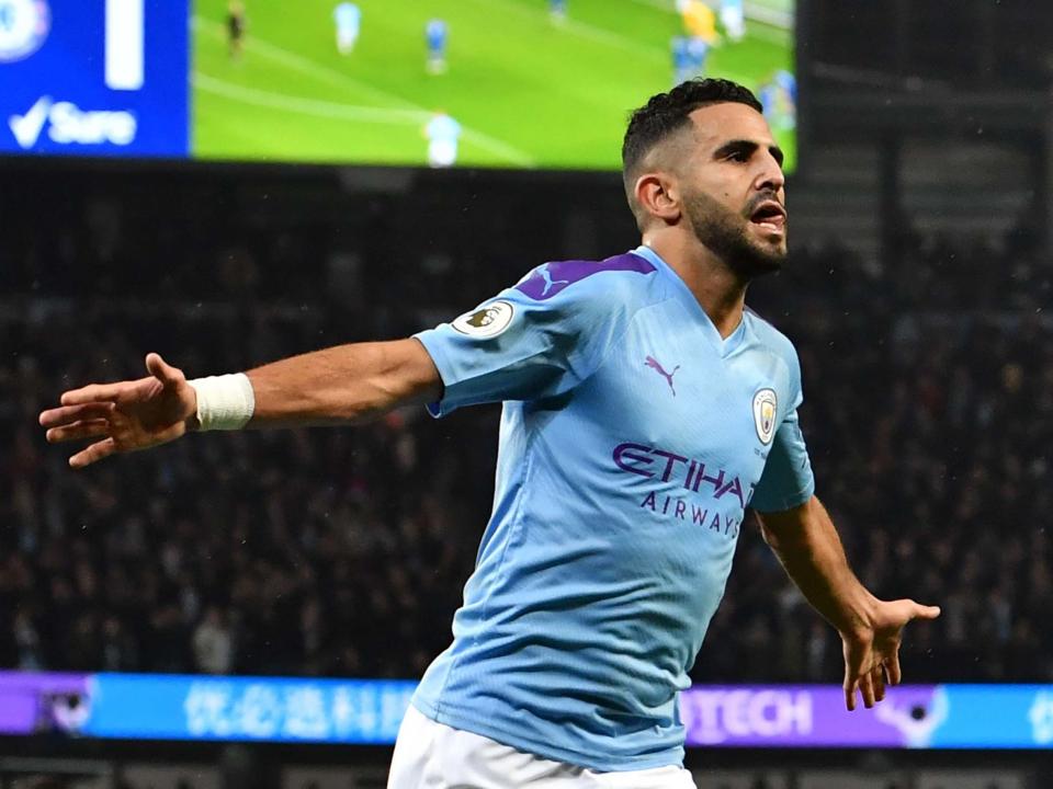 Riyad Mahrez celebrates scoring City's second goal: Getty