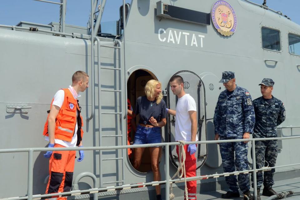 British tourist Kay Longstaff exits Croatias coast guard ship in Pula, which saved her after falling off a cruise ship near Croatian coast. (Getty Images)