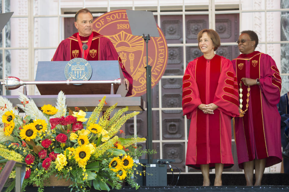 IMAGE DISTRIBUTED FOR USC - Interim USC President Wanda Austin, right, and USC Board of Trustees Chair Rick Caruso, left, bestow USC President Carol L. Folt with the Medal of Office during her inauguration Friday Sept. 20, 2019 in Los Angeles. (Phil McCarten/AP Images for USC)