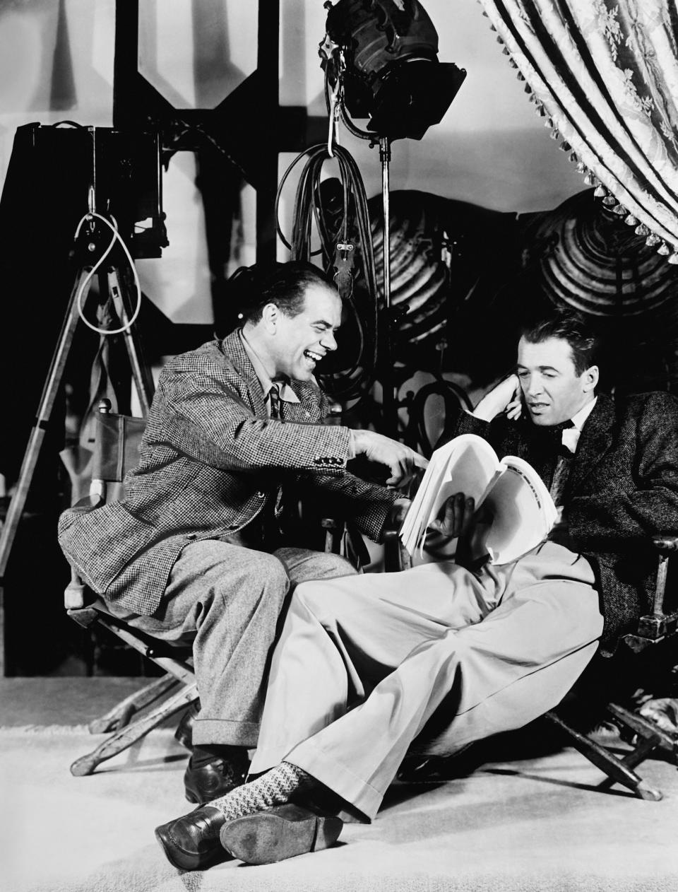 Director Frank Capra and James Stewart on the set of 'It's a Wonderful Life'