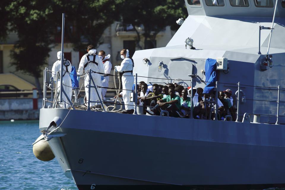 An Armed Forces of Malta patrol boat carrying rescued migrants approaches the AFM Maritime Squadron base at Haywharf in Valletta's Marsamxett Harbour