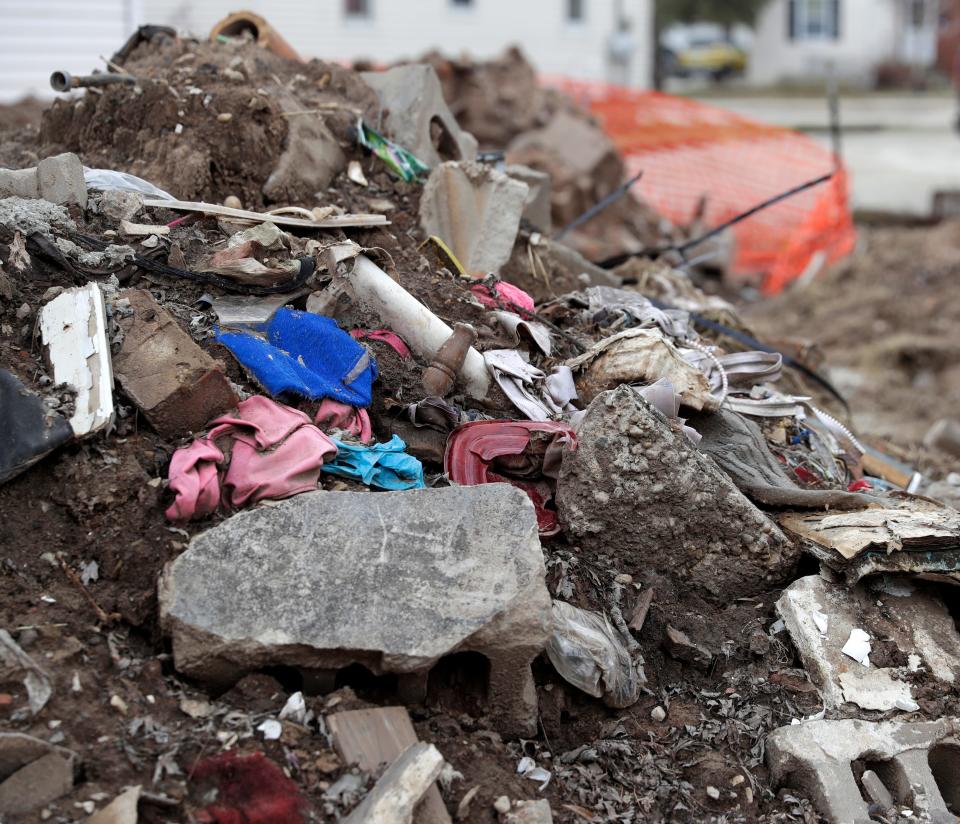 Debris still is gathered behind Lory Stoneburner's house after the basement and foundation were destroyed by East River flooding three years ago.