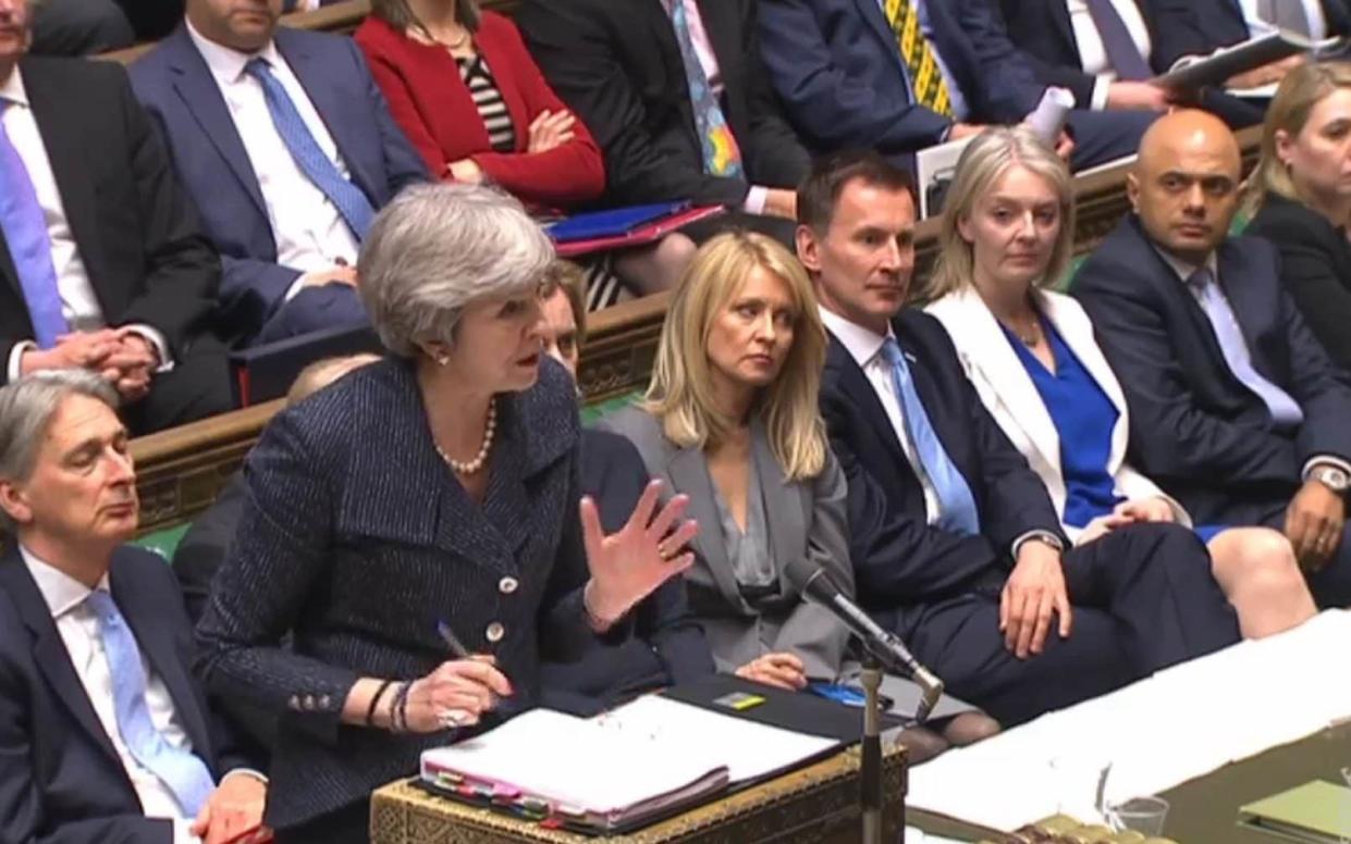 Theresa May and her front bench at PMQs - PA