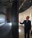 French President Francois Hollande visits the museum of Resistance at the Mont Valerien in Suresnes, West of Paris, Friday Feb. 21, 2014, as part of an homage to French resistance members who fought during World War II, President Francois Hollande says two women who fought with the French Resistance during World War II will be inducted into Paris' renowned Pantheon, the eternal resting place of dozens of French greats.(AP Photo/Remy de la Mauviniere/Pool)