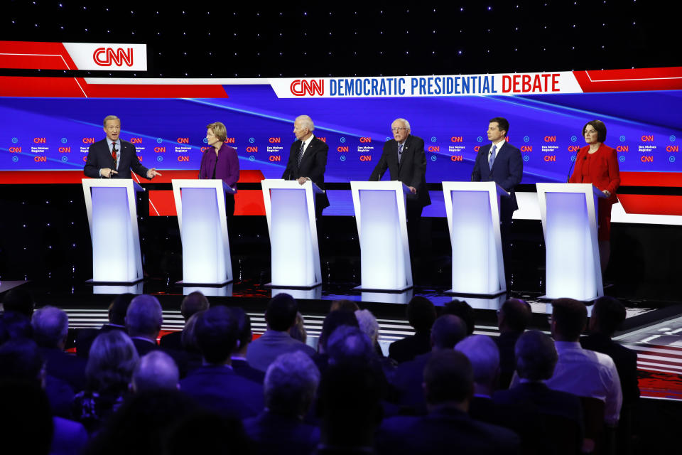 From left, Democratic presidential candidates businessman Tom Steyer speaks as, Sen. Elizabeth Warren, D-Mass., former Vice President Joe Biden, Sen. Bernie Sanders, I-Vt., former South Bend Mayor Pete Buttigieg, and Sen. Amy Klobuchar, D-Minn. listen Tuesday, Jan. 14, 2020, during a Democratic presidential primary debate hosted by CNN and the Des Moines Register in Des Moines, Iowa. (AP Photo/Patrick Semansky)