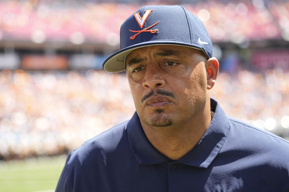 Virginia head coach Tony Elliott jogs off the field a the end the first half of an NCAA college football game against Tennessee, Saturday, Sept. 2, 2023, in Nashville, Tenn. (AP Photo/George Walker IV)