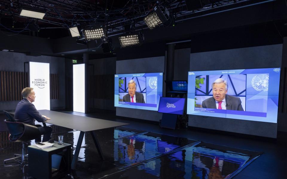 President of the World Economic Forum Borge Brende listens to UN Secretary-General Antonio Guterres through a screen during the Davos Agenda 2022 - SALVATORE DI NOLFI/EPA-EFE/Shutterstock