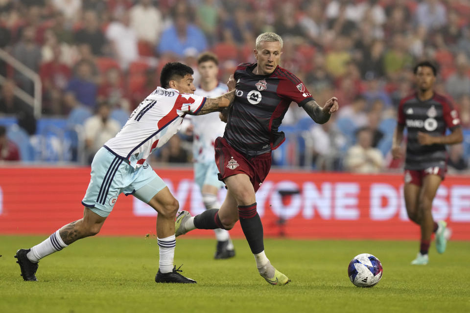 Chicago Fire's Federico Navarro, left, defends against Toronto FC's Federico Bernardeschi during the second half of an MLS soccer match Wednesday, May 31, 2023, in Toronto. (Chris Young/The Canadian Press via AP)