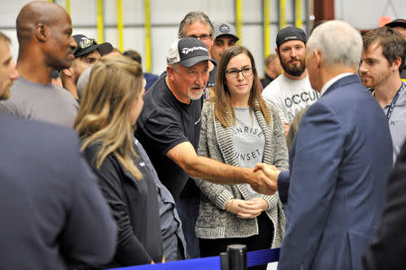 U.S. Vice President Mike Pence talks with SpaceX employees during a tour of the SpaceX hangar at Launch Complex 39-A, where the Dragon crew module and Falcon 9 booster rocket are being prepared for a January 2019 launch at Cape Canaveral, Florida, U.S. December 18, 2018. REUTERS/Steve Nesius