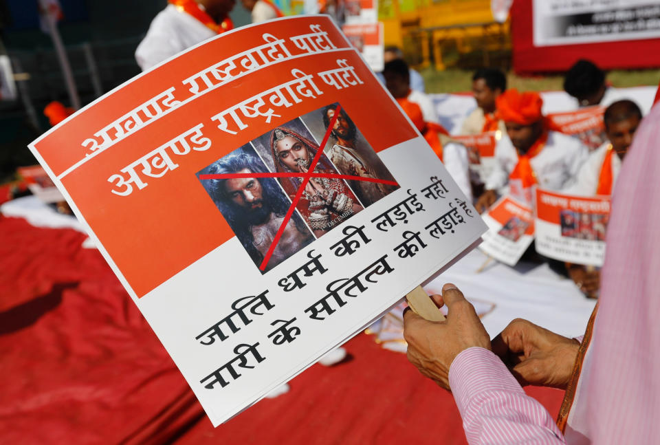 Members of the Rajput community protest against the release of the upcoming Bollywood movie 'Padmaavat' in Mumbai, India, January 20, 2018. The bottom half of the sign reads "It's not the fight for caste religion, it's the fight for devotion of a woman." (REUTERS/Danish Siddiqui)