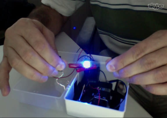 André Studart demonstrates a version of his new material with an LED embedded into it.