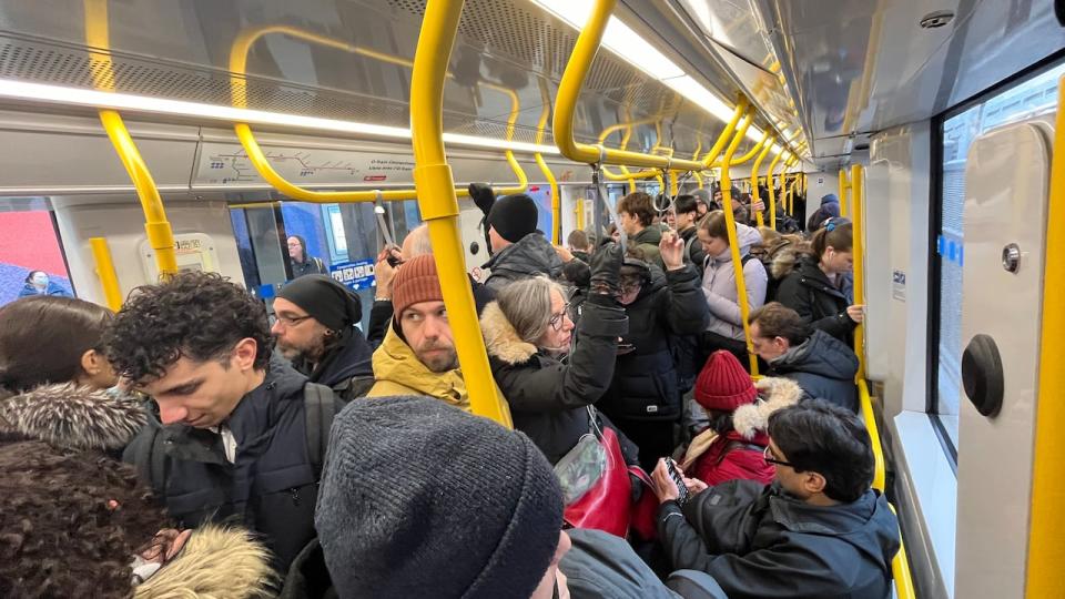 A busy eastbound O-Train heads toward downtown Ottawa the morning of April 4, 2024. A stopped train around Bayview station had disrupted the Confederation Line.