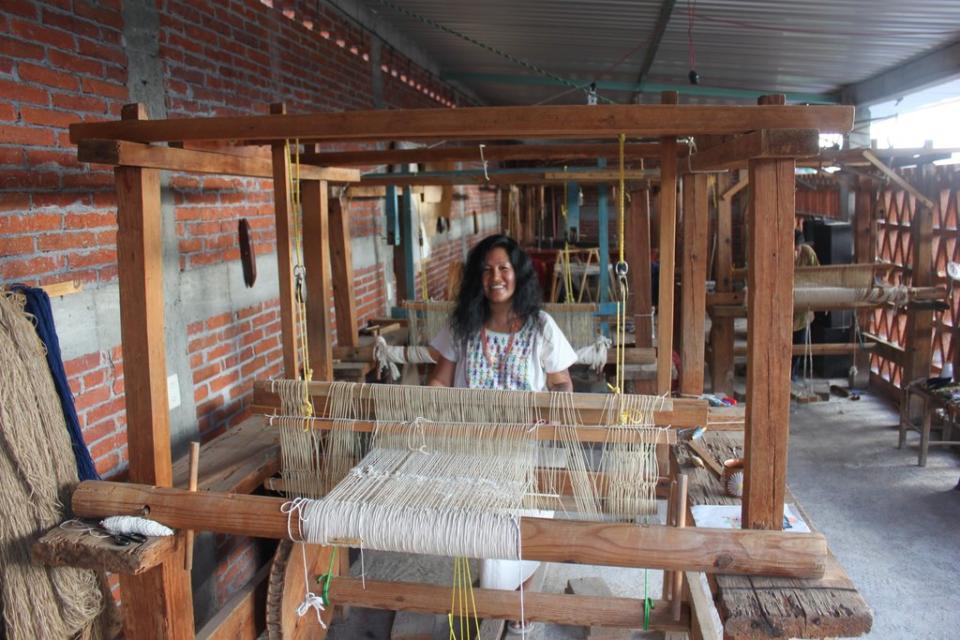 Cynthia at work on a loom.