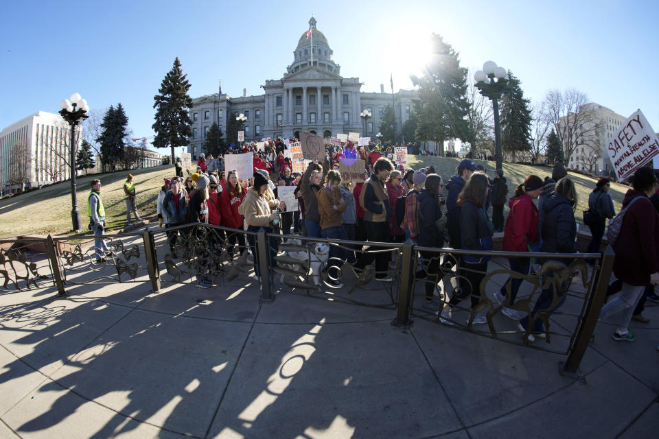 Students and parents from schools across Colorado take part in a rally, Friday, March 24, 2023, outside the State Capitol in Denver, calling for state lawmakers to consider gun control measures during the current legislative session. (AP Photo/David Zalubowski)