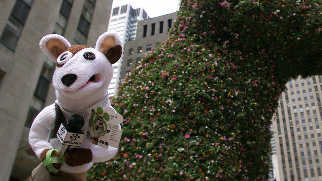 The Pets.com Sock Puppet makes an appearance near Jeff Koons' 