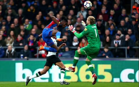 Karius in midair moments before he wipes out Zaha to concede a penalty - Credit:  Jordan Mansfield/Getty Images