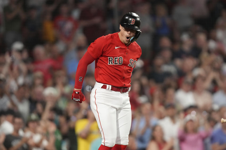 Boston Red Sox's Enrique Hernandez celebrates after his home run as he returns to the dugout in the seventh inning of a baseball game against the Cincinnati Reds, Thursday, June 1, 2023, in Boston. (AP Photo/Steven Senne)