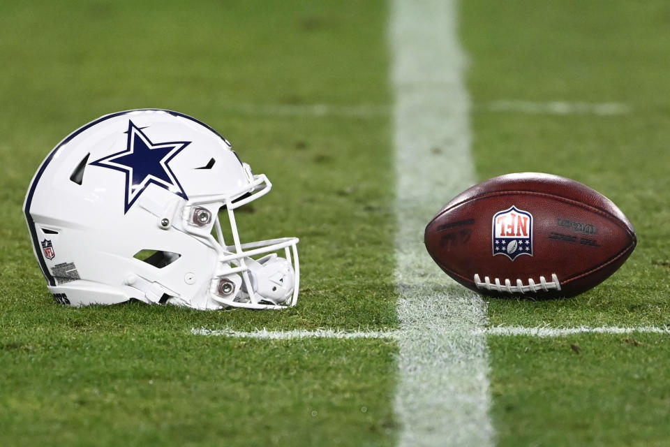 The Cowboys wore a white version of their classic helmet on Thursday night. (AP Photo/Mark Zaleski)