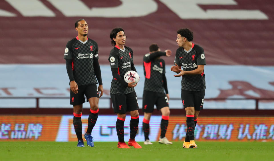 BIRMINGHAM, ENGLAND - OCTOBER 04: Virgil van Dijk of Liverpool , Takumi Minamino of Liverpool  react after Aston Villas 6th goal during the Premier League match between Aston Villa and Liverpool at Villa Park on October 04, 2020 in Birmingham, England. Sporting stadiums around the UK remain under strict restrictions due to the Coronavirus Pandemic as Government social distancing laws prohibit fans inside venues resulting in games being played behind closed doors. (Photo by Catherine Ivill/Getty Images)