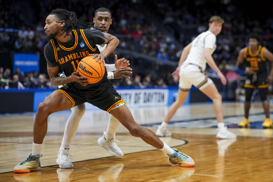 Grambling State guard Jourdan Smith drives to the basket against Montana State guard Eddie Turner III during the first half of a First Four game in the NCAA men's college basketball tournament Wednesday, March 20, 2024, in Dayton, Ohio. (AP Photo/Aaron Doster)