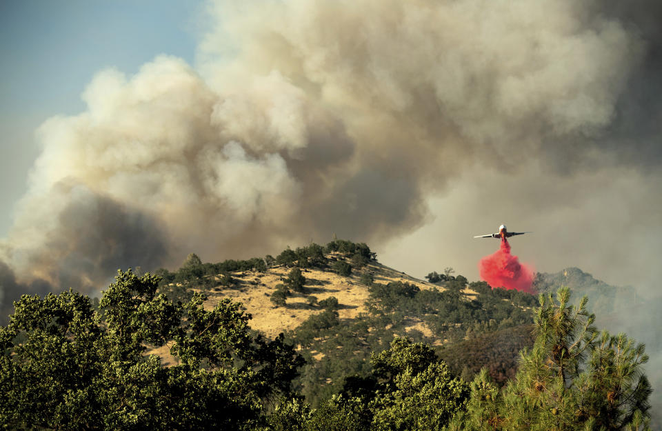 Wind-driven wildfires threatened homes in Northern California