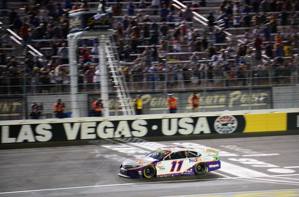 Denny Hamlin crosses the start/finish line during the 2021 NASCAR playoff race at Las Vegas Motor Speedway.