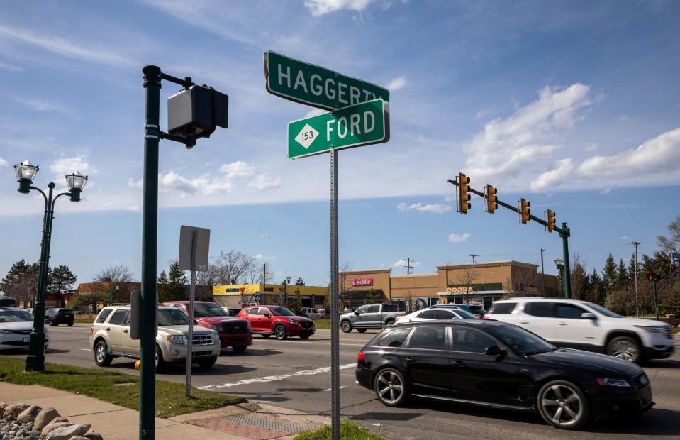 Dozens of cars drive through Ford Road in Canton on Tuesday, April 9, 2024. The Michigan Department of Transportation plans to spend $65 million to rebuild 2.5 miles of Ford Road.