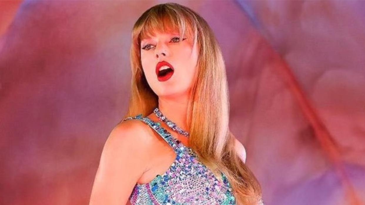  Taylor Swift performing on stage in Taylor Swift: The Eras Tour concert movie . 
