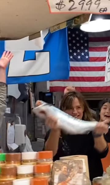 Jennifer Garner holding a fish aloft