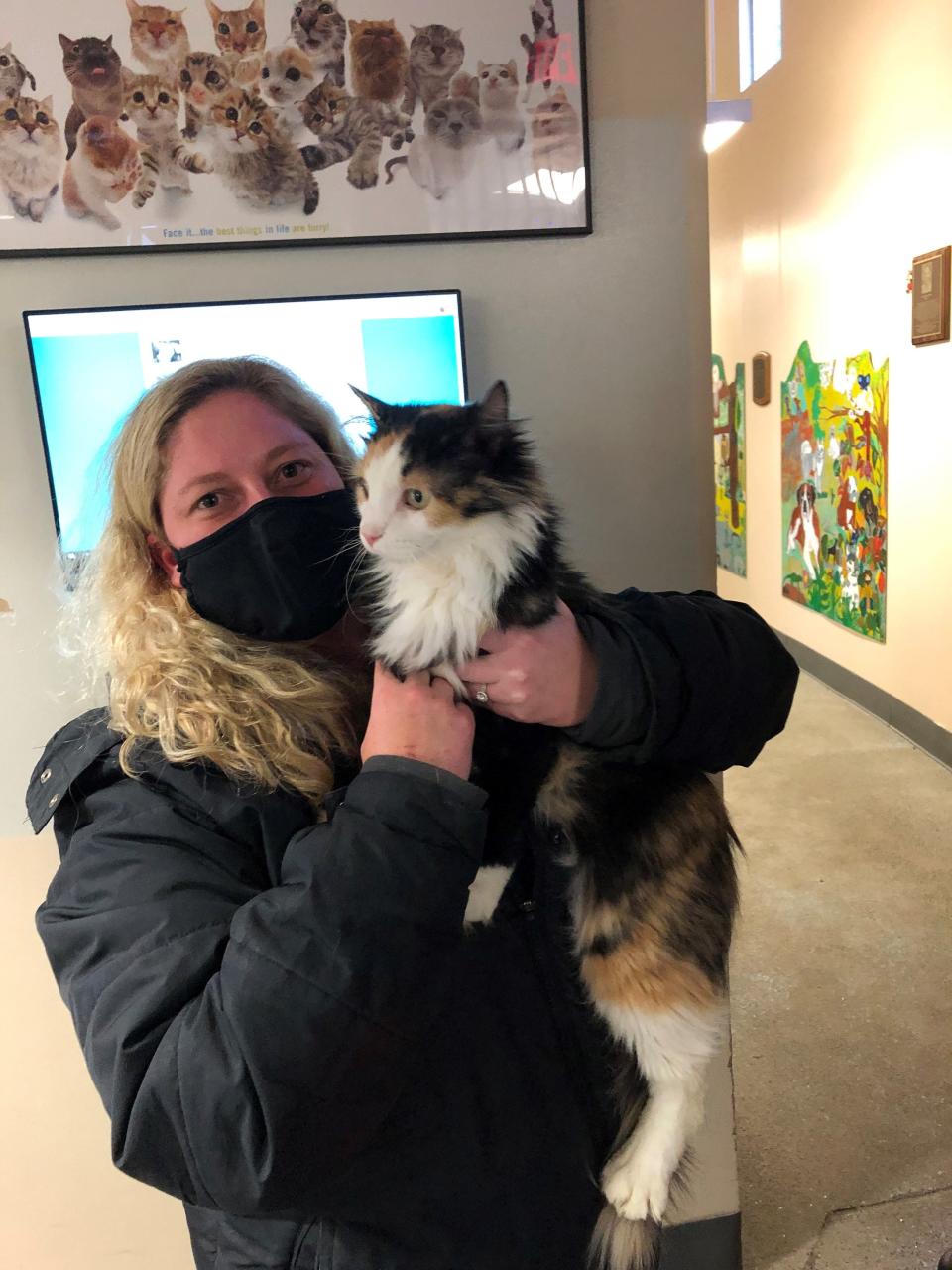 Kara Hanlon of Des Moines reunited with her cat Lottie, who got lost in 2016, thanks to the Animal Rescue League and Lottie's microchip.